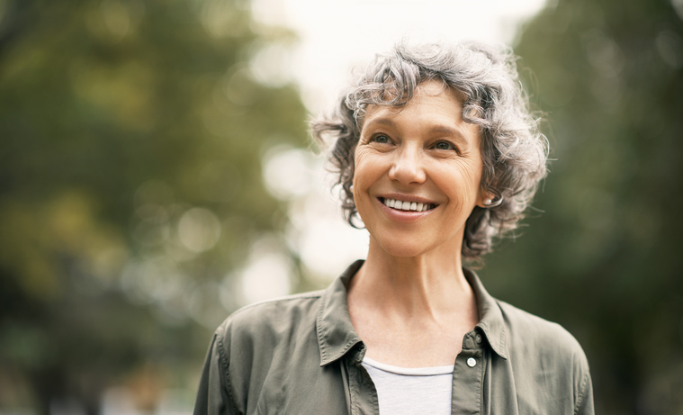 Woman-standing-outside-smiling
