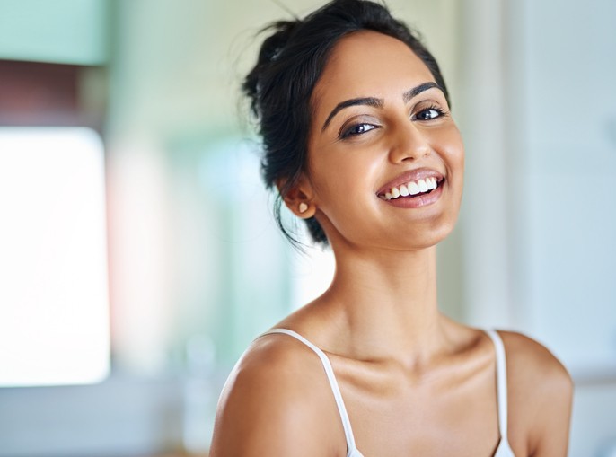 Attain a picture-worthy smile like this woman's with composite bonding.